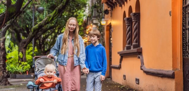 Mother,With,Her,Two,Sons,Exploring,Lush,Streets,Of,Condesa,