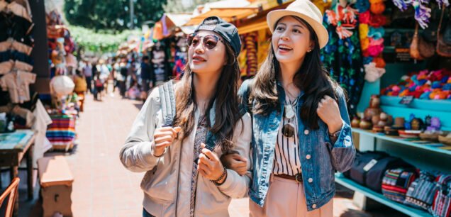 Pretty,Backpackers,Cheerfully,Shopping,In,The,Mexican,Street,Together.,Travelers